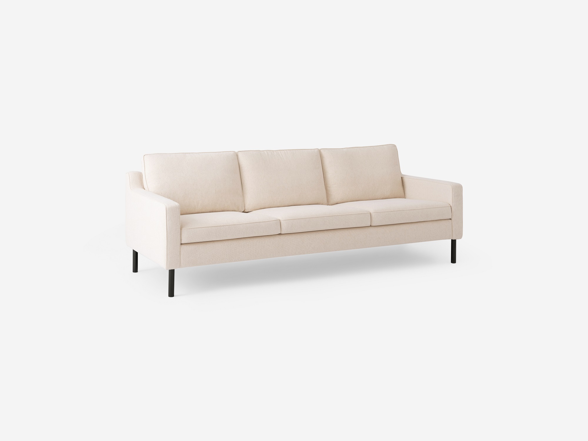 Angled view of the Skye mid century couch in white fabric